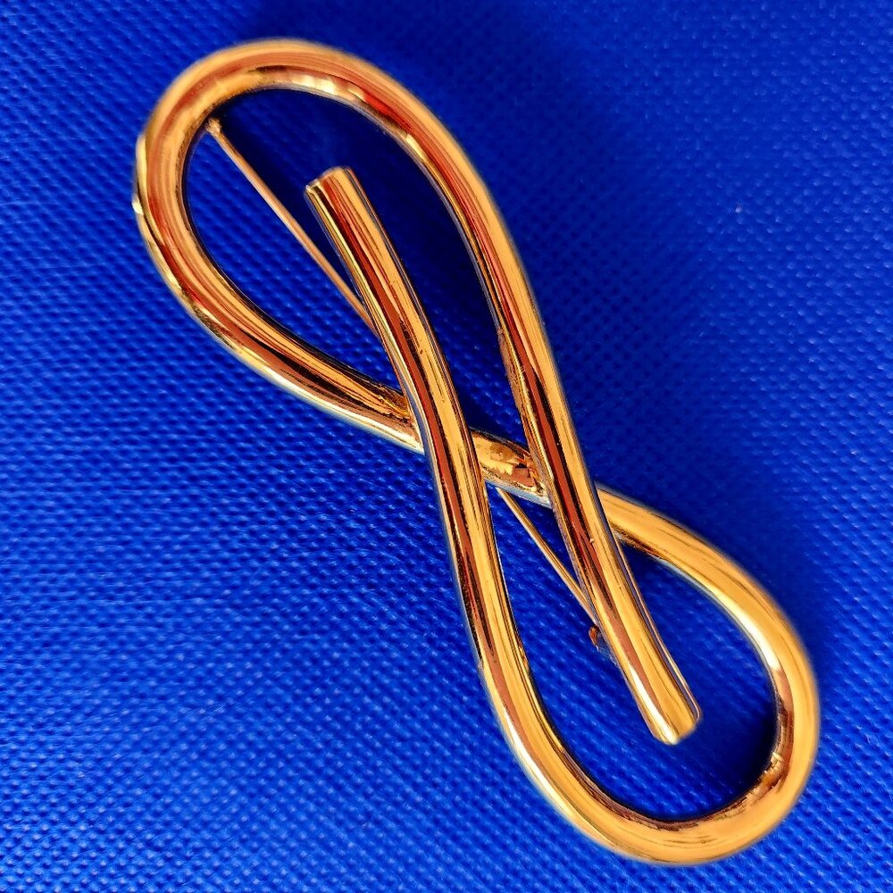 1980-S NINA RICCI SIGNED BIG VINTAGE GOLD TONE BOW BROOCH